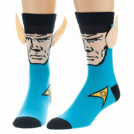 blue socks with black cuff and yellow star trek insignia on ankle. photo-realistic image of spock from shoulders up with hands together in front. spock's ears stick out above the sock cuff.  