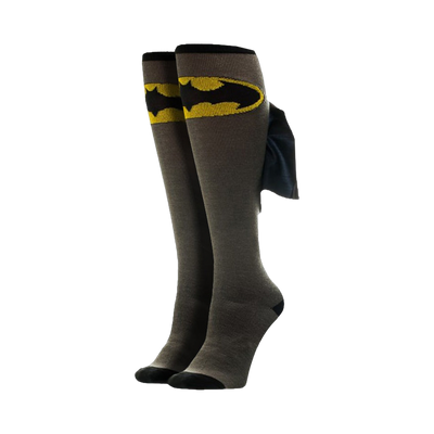 Pair of grey knee-high socks with a yellow Batman logo and a black cape detail on the side. 