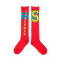 Pair of red knee-high socks. One sock displays 'SUPERMAN' vertically, the other a large yellow 'S' with blue trim. Both have thin blue stripes.