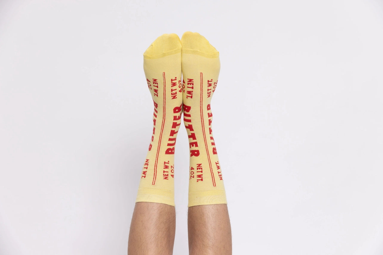 Yellow socks with red text on a white background