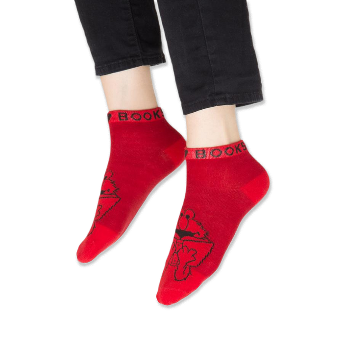 Detail of the yellow sock cuff highlighting partial text above Big Bird.