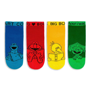 Four bright Sesame Street ankle socks in blue, red, yellow, and green showing characters reading books in black line art.