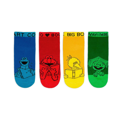 Four bright Sesame Street ankle socks in blue, red, yellow, and green showing characters reading books in black line art.