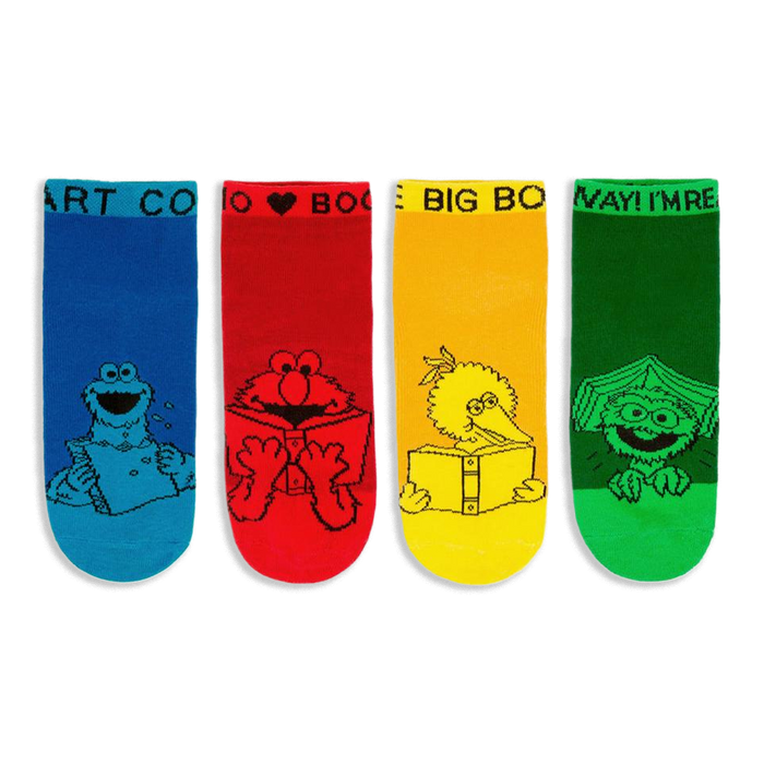 Four bright Sesame Street ankle socks in blue, red, yellow, and green showing characters reading books in black line art.