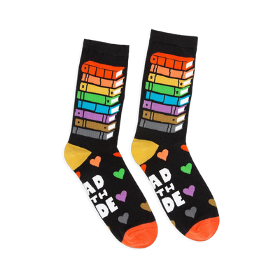 Black crew socks featuring a tall stack of rainbow-colored books on the leg and Read With Pride text with colorful hearts.