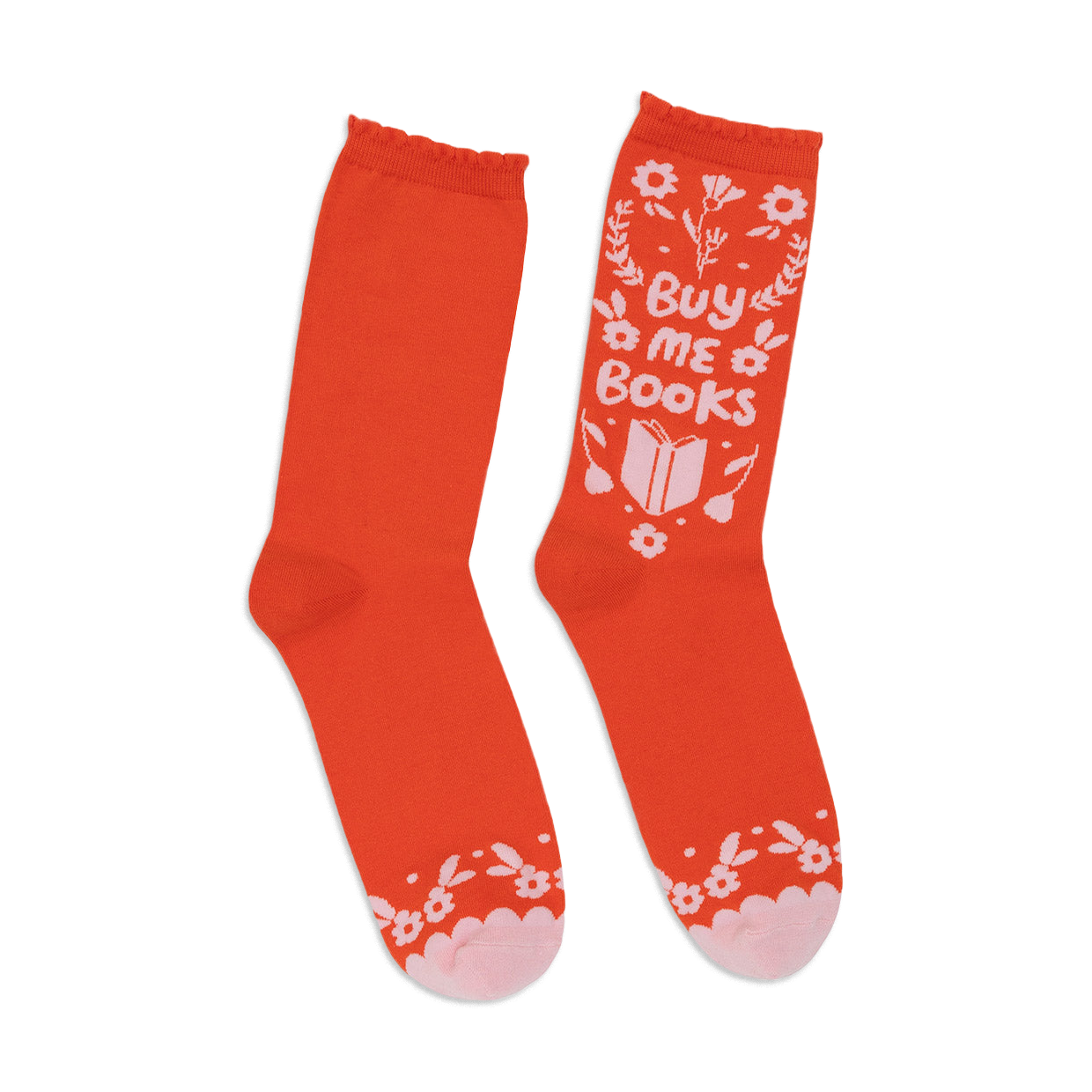 A pair of orange crew socks with a whimsical 'Buy Me Books' design in white and pink.  Features floral accents and a book graphic.