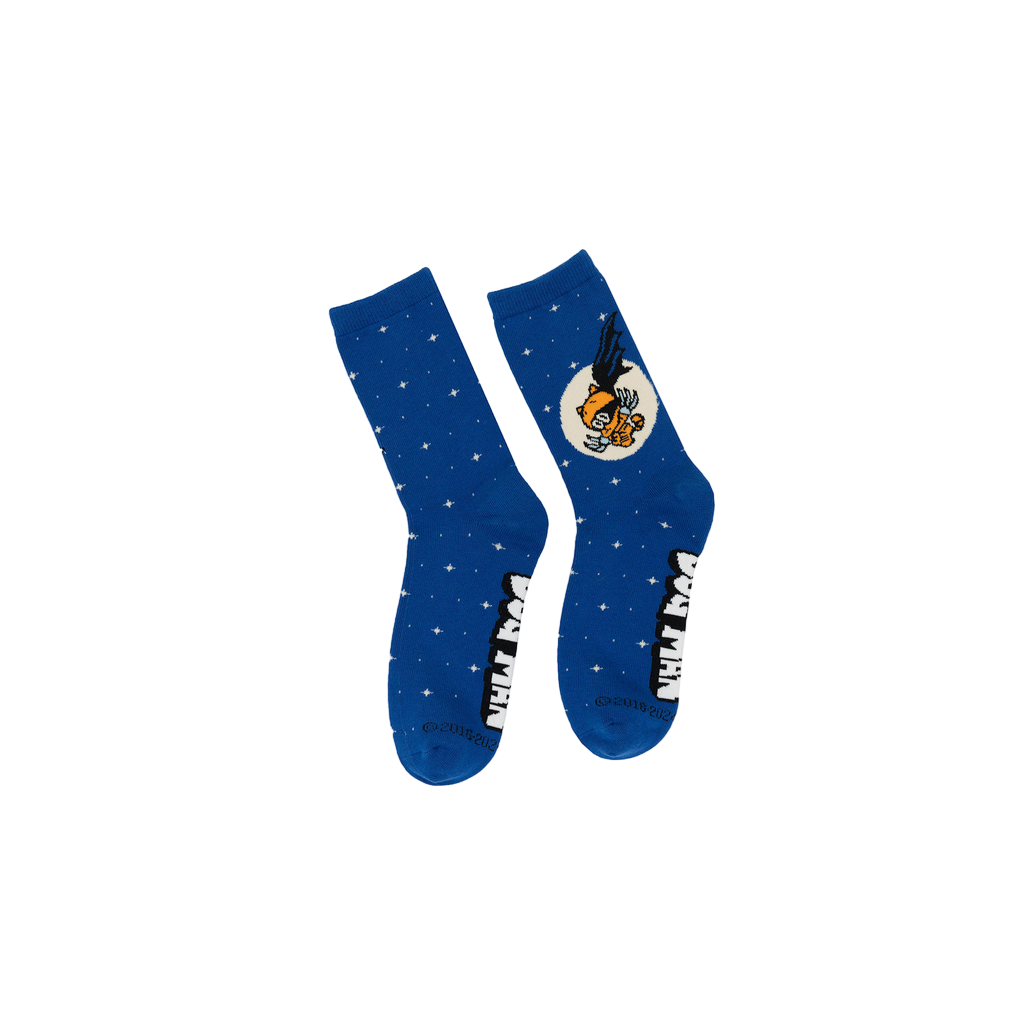 Lifestyle shot showing the Dog Man socks on a person's feet. 