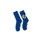 Lifestyle shot showing the Dog Man socks on a person's feet. 