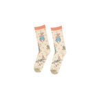 Pair of Peter Rabbit crew socks, light beige with peach ruffled cuffs and olive green toes, laid flat on a white background.