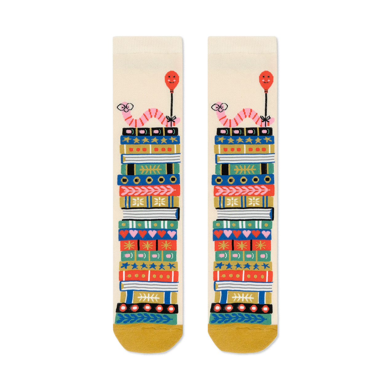 Cream crew socks with a whimsical design of colorful book stacks and pink worms holding balloons.