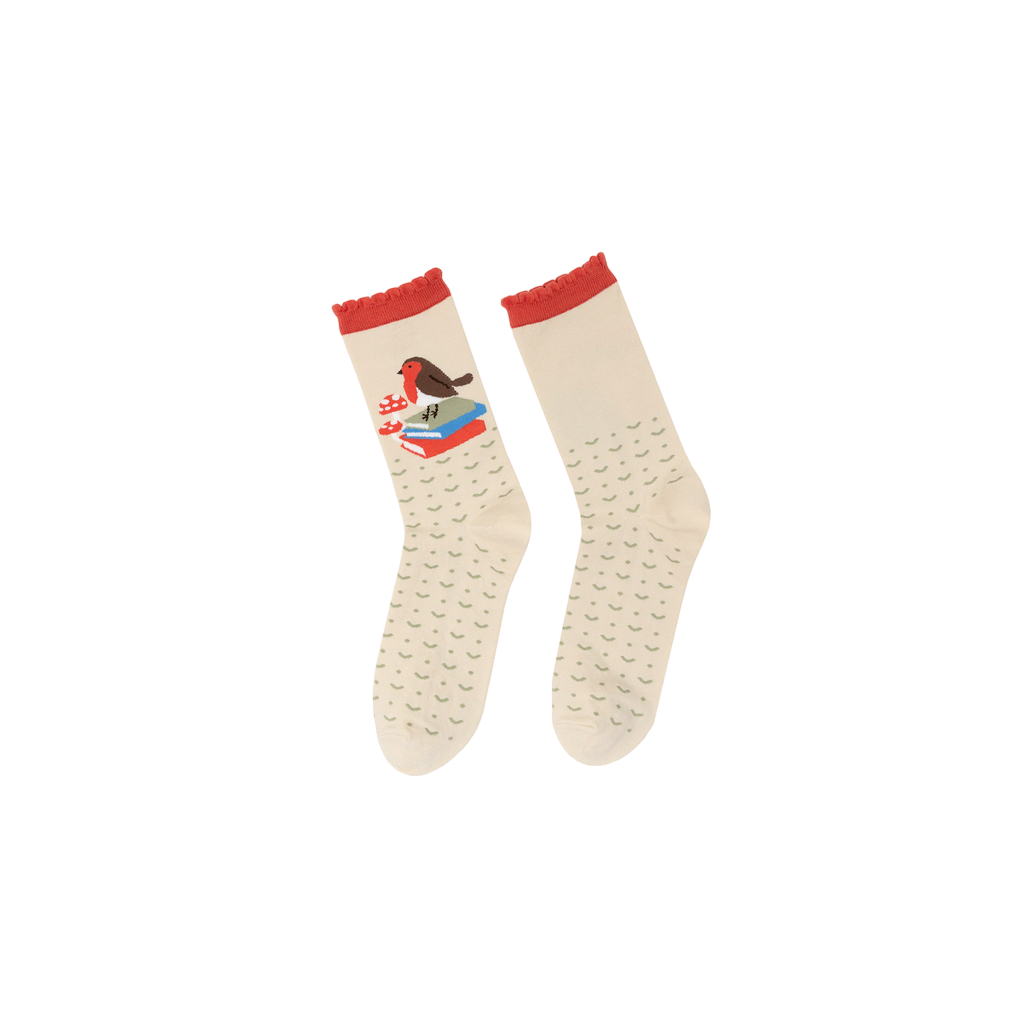 Flat lay image of cream crew socks featuring a robin perched on books.