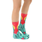 Side view of Buddha socks on a person's legs, showcasing the sock's design and fit. [lf]