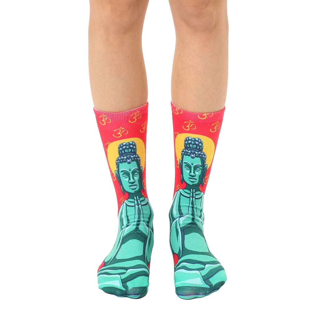 Pair of crew socks featuring a teal Buddha image on a red background with Om symbols. [lf]