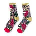 Sheer socks displaying bright flowers, green leaves, magenta toes, solid heels, and sparkly gold cuffs on a dark background.