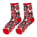 Flat lay of sheer mesh socks with opaque teddy bear faces, red cherries, mustard ruffled cuffs, and bright pink heels.