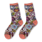 Pair of sheer mesh socks on a black background featuring colorful floral embroidery and solid dusty rose cuffs and toes