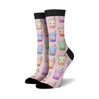 Crew socks with a pink background featuring a repeating pattern of cute cartoon boba tea cups in various pastel colors.