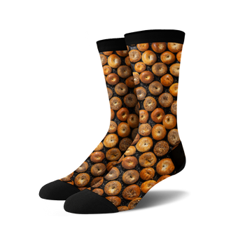 black crew socks with a 360-degree pattern of various types of bagels, including plain, sesame, poppy seed, and everything bagels.  