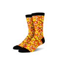 A pair of crew socks covered in a candy corn print. The socks are predominantly orange, yellow, and white, with a black cuff.