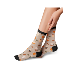 Lifestyle shot of a model wearing Pumpkin Spice Latte socks, showing how they look on.
