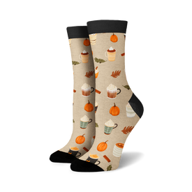 black top, beige background crew socks with pumpkin spice latte pattern: pumpkin, coffee cups, cinnamon sticks, fall leaves.   