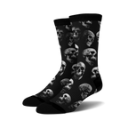 Pair of black crew socks with a repeating grayscale skull pattern.  Edgy and stylish.