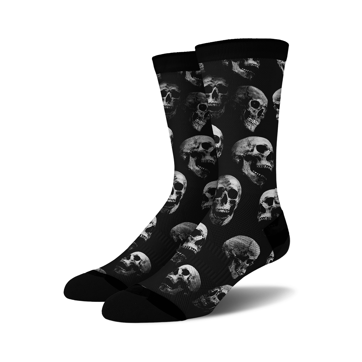 Pair of black crew socks with a repeating grayscale skull pattern.  Edgy and stylish.