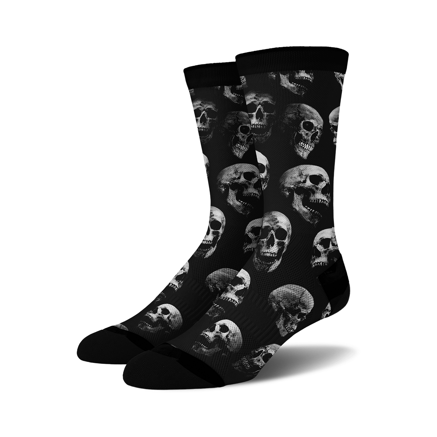 Pair of black crew socks with a repeating grayscale skull pattern. 