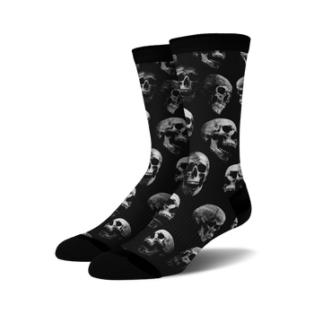 black crew socks with a pattern of white skulls.  