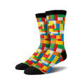 Pair of crew socks with a Lego-inspired design.  The socks are predominantly red, yellow, blue, and white, with a black cuff.