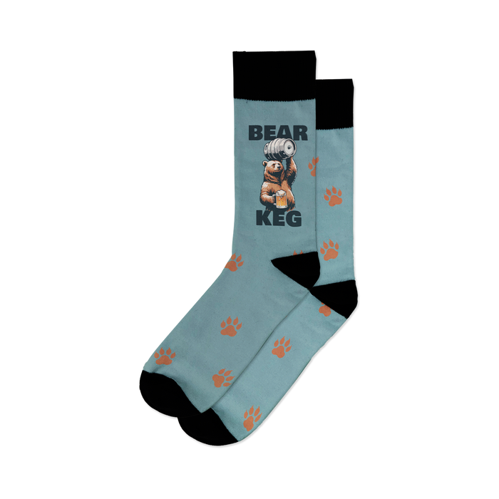 A pair of blue socks with a brown bear graphic on the leg. The bear is holding a keg of beer and the word 