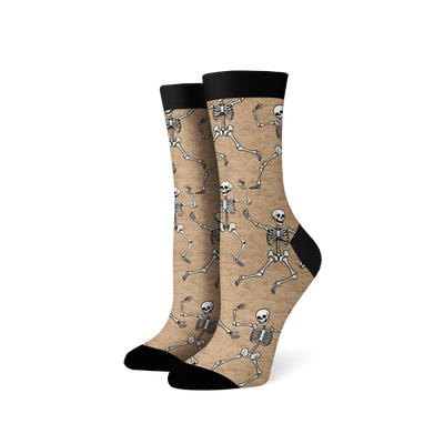 Pair of crew socks; beige and black options; dancing skeleton pattern.