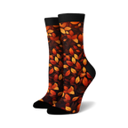 Lifestyle shot of 'Autumn Leaves' socks on a model's feet, showing the socks in a casual setting.