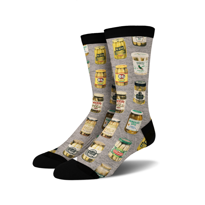 A pair of gray socks with an all-over pattern of various brands of pickles.
