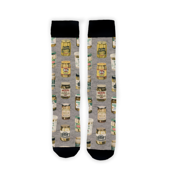 A pair of gray socks with an all-over pattern of various brands of pickles.