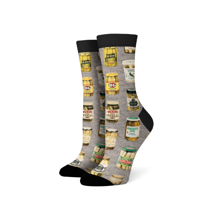 Pair of crew socks with a gray background and a repeating pattern of illustrated vintage pickle jars in various colors. 