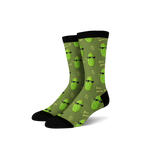 Pair of crew socks in olive green with repeating pattern of cartoon pickles wearing sunglasses and making a hand gesture. 