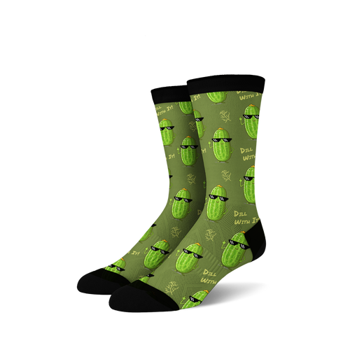 Pair of crew socks in olive green with repeating pattern of cartoon pickles wearing sunglasses and making a hand gesture. 