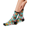 Lifestyle shot of a woman's legs wearing the donut socks, showing how they look when worn.