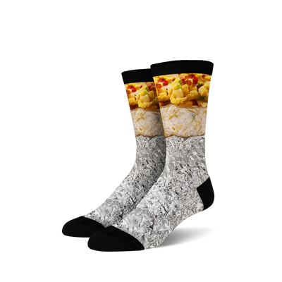 Pair of crew socks with a breakfast burrito design. The socks are primarily white, gray (foil), and feature yellows and browns of the burrito filling.