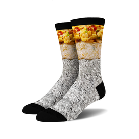 black at the top, white and gray at the bottom. looks like a classic breakfast burrito wrapped in tin foil with red and green pieces. fun crew socks for men and women who love burritos.  