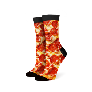 Lifestyle shot of a person wearing the pepperoni pizza socks.