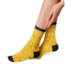 Close-up flatlay showcasing the detailed mac and cheese print on the Mac & Cheese 360 socks.