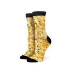 Lifestyle shot of a person wearing Alfredo Pasta socks, showing them from the ankles down.
