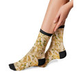 Flat lay product shot of a pair of Alfredo Pasta socks on a black background.