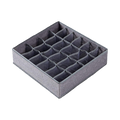 Empty grey fabric sock organizer with 24 compartments, showing the internal structure.