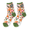 Flat lay of sheer crew socks with an orange fox and pink floral pattern, featuring solid olive green trims on the ends.