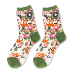 Flat lay of sheer crew socks with an orange fox and pink floral pattern, featuring solid olive green trims on the ends.
