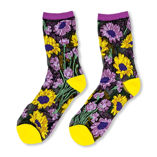 Sheer black socks with yellow sunflowers and purple flowers, featuring solid yellow toes, heels, and purple cuffs.