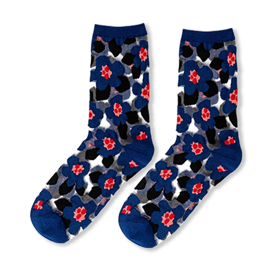 Sheer crew socks featuring large royal blue flowers, bright pink centers, and black abstract shapes on a translucent base.